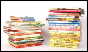 COLLECTION OF COMICS , ANNUALS AND BOOKS RELATED TO THE WILD WEST