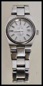 A vintage Omega Seamaster Cosmic 2000 having a stainless steel watch bracelet with a round face,