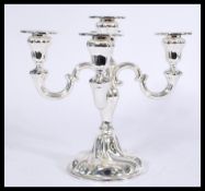A vintage 20th century WMF silver plated five point candelabra having scrolled branch arms.