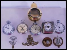 A collection of 20th century time pieces to include pocket watches by Railway Timekeeper,
