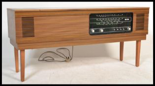 A retro 20th Century teak appearance radiogram / cabinet entertainment unit by Ultra. Radio and