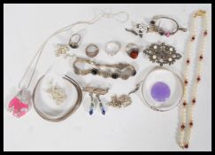 A collection of 20th century silver jewellery to include a silver split band bangle, a silver bangle