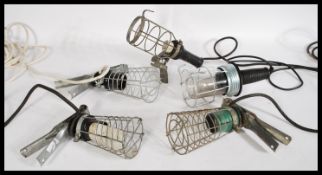 A group of five vintage retro 20th century industrial inspection - cage trouble lamps with clamp