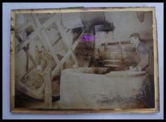 A vintage early 20th century photograph on glass depicting The Well at Carisbrooke castle with man