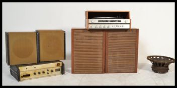 A vintage retro Audix amplifier unit along with a pair of retro speakers and a Celeston 12