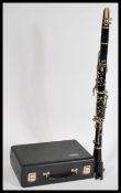 A cased Bundy Resonite The Selmer Company U.S.A five piece clarinet, housed within its original