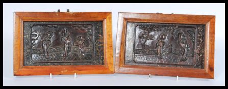 A pair of 19th century Chinese lacquer panels featuring relief scenes of villagers within modern