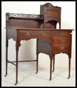 A small late Victorian mahogany ladies writing desk, single bank of three drawers, with raised