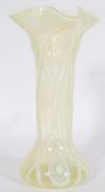 A 20th century vintage Vaseline uranium yellow glass vase having a bulbous formed base and splayed
