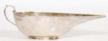 An early 20th century silver hallmarked pap boat having an elongated lip bearing hallmarks for