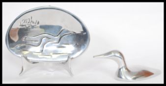 A Hoseldon Canadian bird sculpture bearing 'Hoseldon 1555' on the underside with a silver plaque