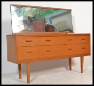 A vintage retro 20th Century teak wood dressing table having an arrangement of six drawers, a full