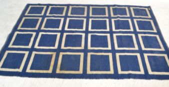 A 20th Century Angora floor rug, the floor rug having reversible double sided design, on blue or