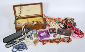 A collection of costume jewellery featuring necklaces, brooches and earrings to include a
