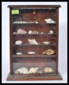 An early 20th century mahogany table top glazed display cabinet with glazed shelves complete with