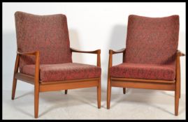 A pair of vintage open framed mid 20th Century Parker Knoll style armchairs, cushion seats and