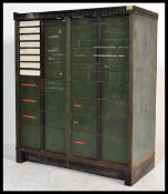 A vintage early 20th century Edwardian industrial metal filing cabinet having a graduating set of