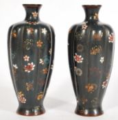 A pair of early 20th century Chinese Cloisonne vases of typical form having floral decoration.