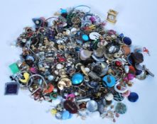 A collection of vintage costume jewellery including a wipe selection of retro clip on earrings and