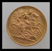 A 1915 George V half sovereign from London mint having a George and dragon design and a George V