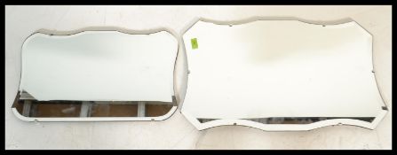 A graduating pair of vintage early 20th century Art Deco wall mirrors having beveled glass panels.