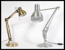 A pair of vintage retro anglepoise desk lamps with brushed metal finish, both made from stainless