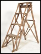 A vintage retro 20th century pine Industrial  metamorphic step ladder. The folding ladder having