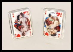 A pair of vintage sterling silver cuff links in the form of playing cards ace and queen.