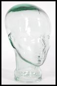 A vintage retro 20th century advertising shop display glass phrenology type head of clear glass