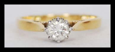 A 18ct gold Birmingham hallmarked solitaire ring with a 33pts brilliant cut diamond in a cathedral