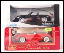TWO BOXED 1:18 SCALE DIECAST MODEL CARS