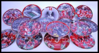 A collection of Liverpool football club commemorative plates featuring players such as King Kenny