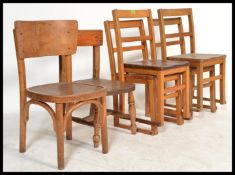 A set of four pre war beech and elm children's stacking chairs, raised on square supports united