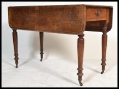 A 19th Century Victorian Pembroke mahogany drop leaf / gate leg dining table raised on turned