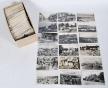 A collection of real photo British postcards, all black and white and small in size with sought