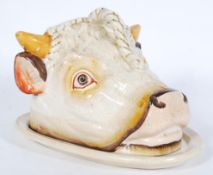 A 19th century Victorian Staffordshire cheese / tongue tray plate and cover in the form of a cows