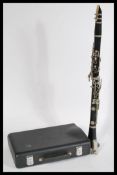 A cased Buffet Crampon & Co of Paris five piece clarinet, housed within its original case. Measures: