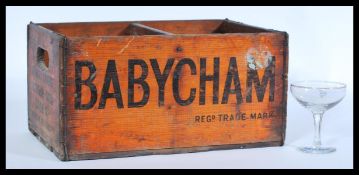 A vintage retro 20th century advertising point of sale Babycham wooden bottle storage crate with