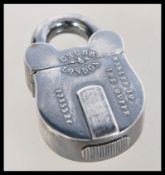 A vintage 20th century silver plated vesta case in the form of a padlock marked Chubb London.