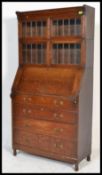 An early 19th Century Edwardian oak bureau bookcase, full front bureau with fully appointed interior
