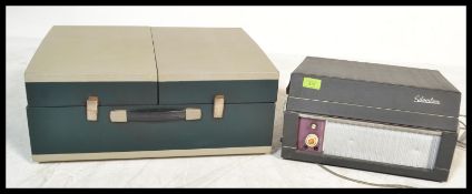 A vintage 1960's portable cased record player, hinged lid opening to reveal speaker and four speed