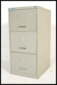 A vintage retro industrial 20th Century metal three drawer filing cabinet, chrome handles to front