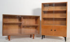 Two retro 20th Century teak wood glazed bookcases, each with full length sliding glass doors,