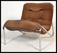 A retro 20th Century Habitat chrome and suede cantilever easy chair, the over stuffed button back