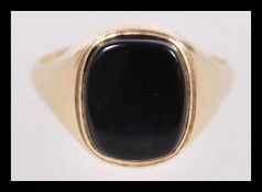 A hallmarked 9ct gold signet ring with inset black agate item weighs 2.2 grams hallmarked Birmingham