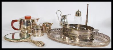 A group of vintage silver plated wares to include an Art Deco three piece tea service. Please see