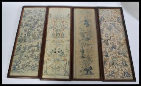 A group of four 19th century oriental Chinese/ Japanese embroidered silk kimono sleeves in wooden