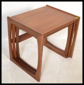 A 1970's G-Plan Kelso teak and tile top nest of tables. The tables of graduating form with tiled