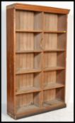 A 19th century Victorian school oak bookcase having open front with 10 section shelved interior.
