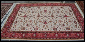 A large  vintage Persian floor carpet Keshan rug having a Beige ground with geometric borders and